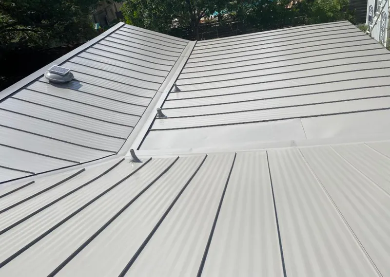 Solar attic fan installed on a metal roof for Roof Ventilation in Kihei